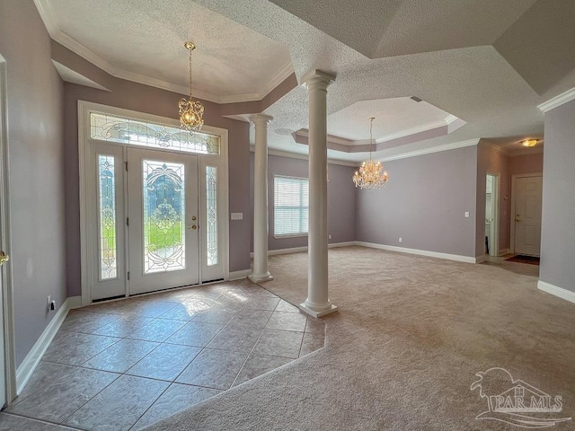 3615 Ward Basin Rd, Milton, FL 32583 - entrance foyer featuring decorative columns, ornamental molding, a chandelier, a textured ceiling, and baseboards