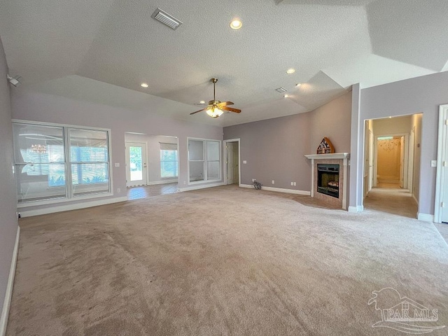 3615 Ward Basin Rd, Milton, FL 32583 - unfurnished living room featuring carpet floors, lofted ceiling, baseboards, a fireplace, and a textured ceiling