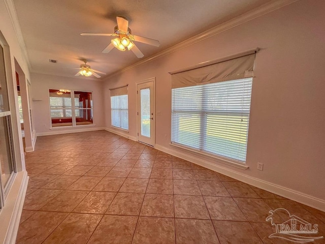 empty room featuring ornamental molding, light tile patterned floors, and ceiling fan with notable chandelier