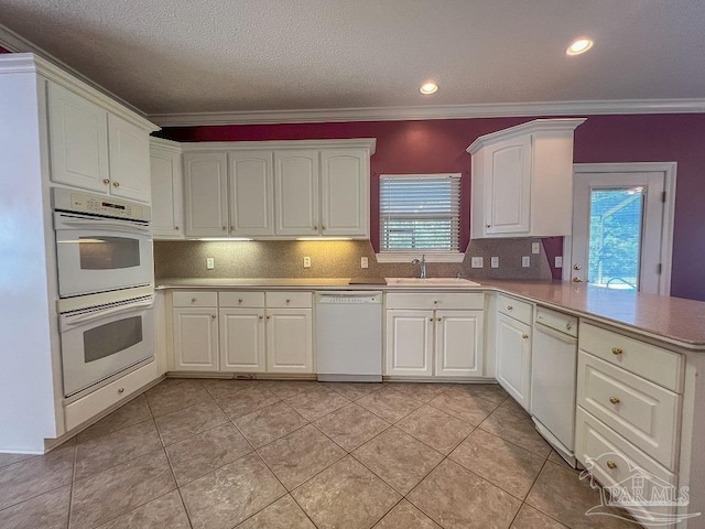 3615 Ward Basin Rd, Milton, FL 32583 - kitchen with white appliances, a sink, a peninsula, backsplash, and crown molding