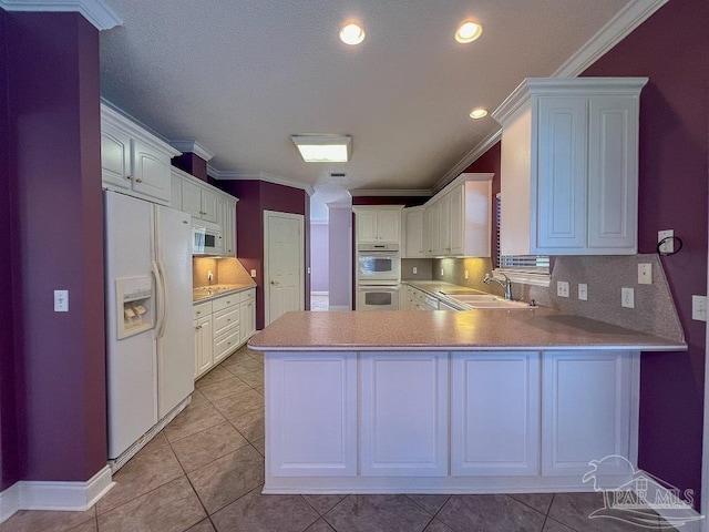 3615 Ward Basin Rd, Milton, FL 32583 - kitchen featuring white appliances, a sink, crown molding, a peninsula, and tasteful backsplash