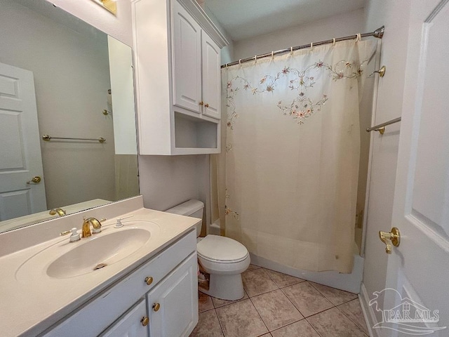 full bathroom featuring vanity, tile patterned floors, toilet, and shower / bath combo