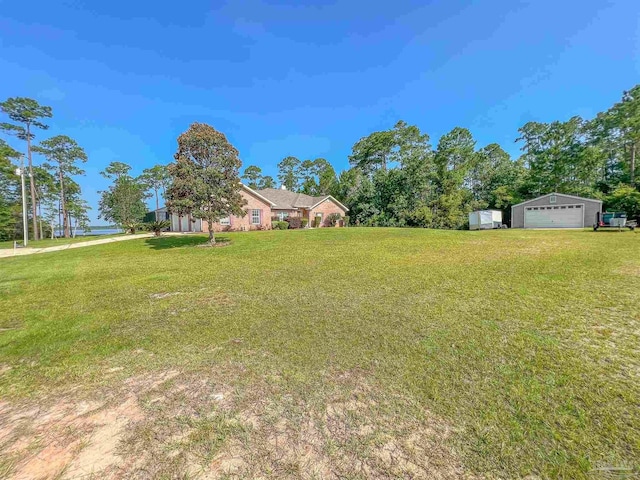 3615 Ward Basin Rd, Milton, FL 32583 - view of grassy yard with a garage and an outdoor structure