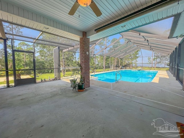3615 Ward Basin Rd, Milton, FL 32583 - outdoor pool featuring glass enclosure, ceiling fan, and a patio area