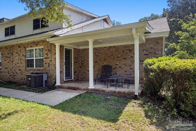 rear view of property featuring central air condition unit