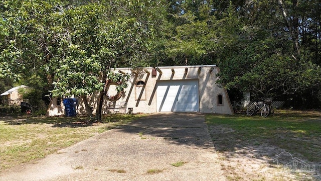 view of front of house featuring a garage and an outdoor structure