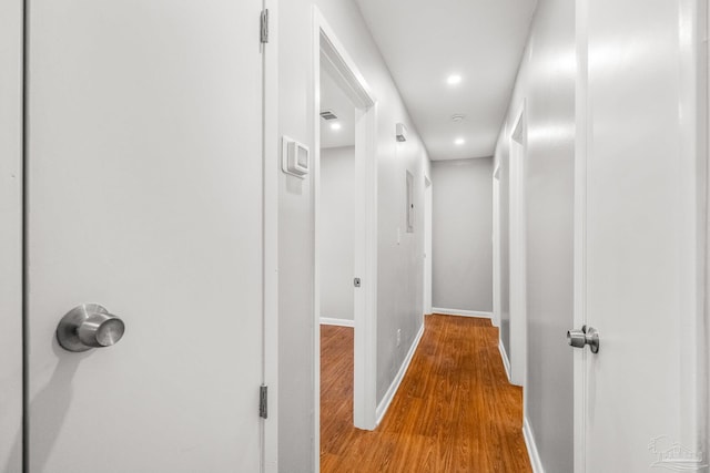 corridor featuring hardwood / wood-style flooring