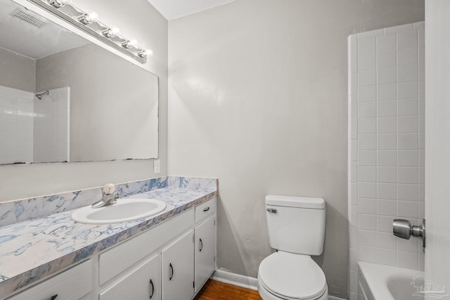 full bathroom with vanity,  shower combination, and toilet