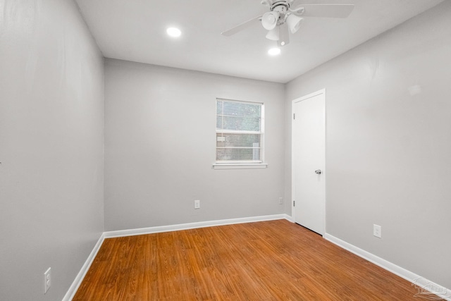 spare room featuring hardwood / wood-style floors and ceiling fan