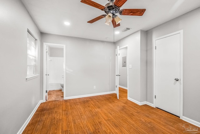 unfurnished bedroom with connected bathroom, ceiling fan, and light hardwood / wood-style floors