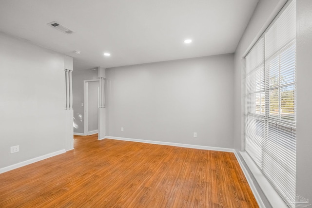 unfurnished room with light hardwood / wood-style floors