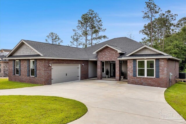 view of front of home featuring a garage and a front yard