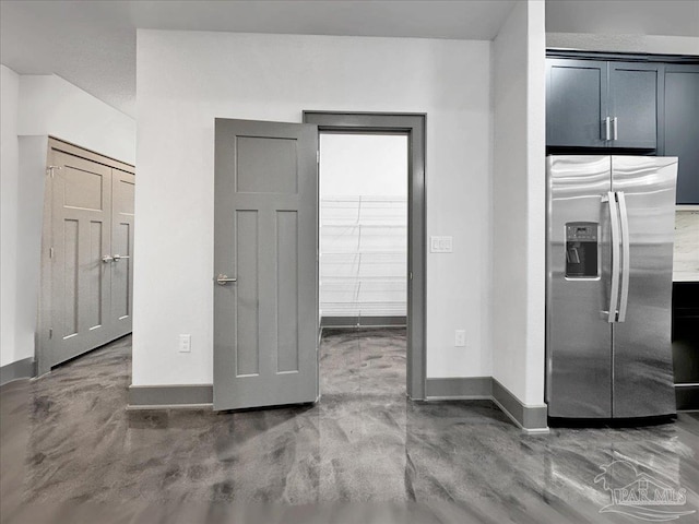 kitchen featuring stainless steel fridge