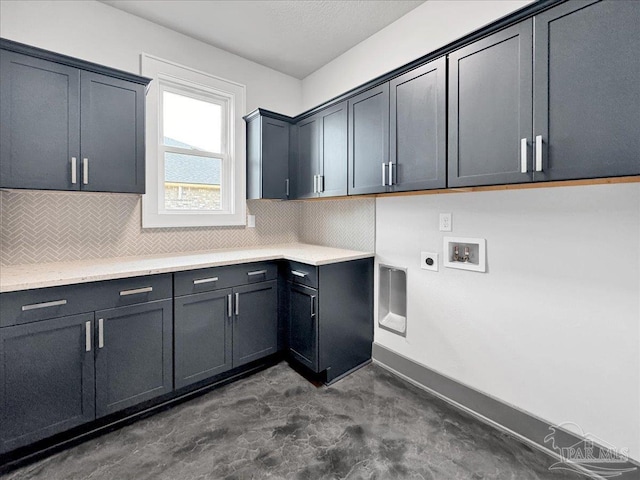 clothes washing area with cabinets, hookup for a washing machine, and hookup for an electric dryer