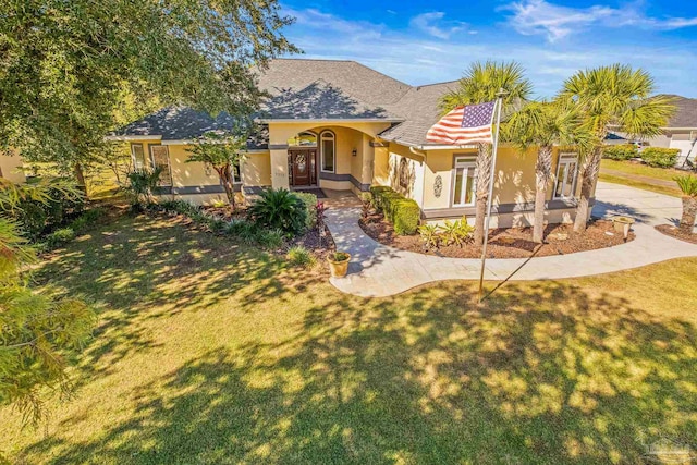 view of front of home with a front lawn