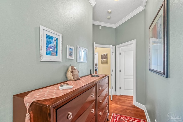 hall featuring crown molding and light wood-type flooring