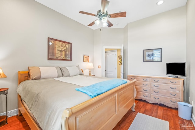 bedroom featuring dark hardwood / wood-style flooring and ceiling fan