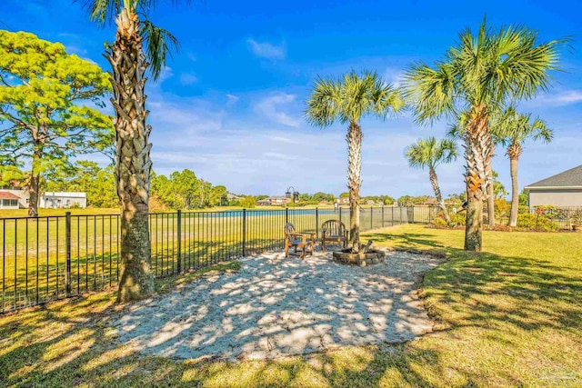 view of patio featuring an outdoor fire pit and a water view