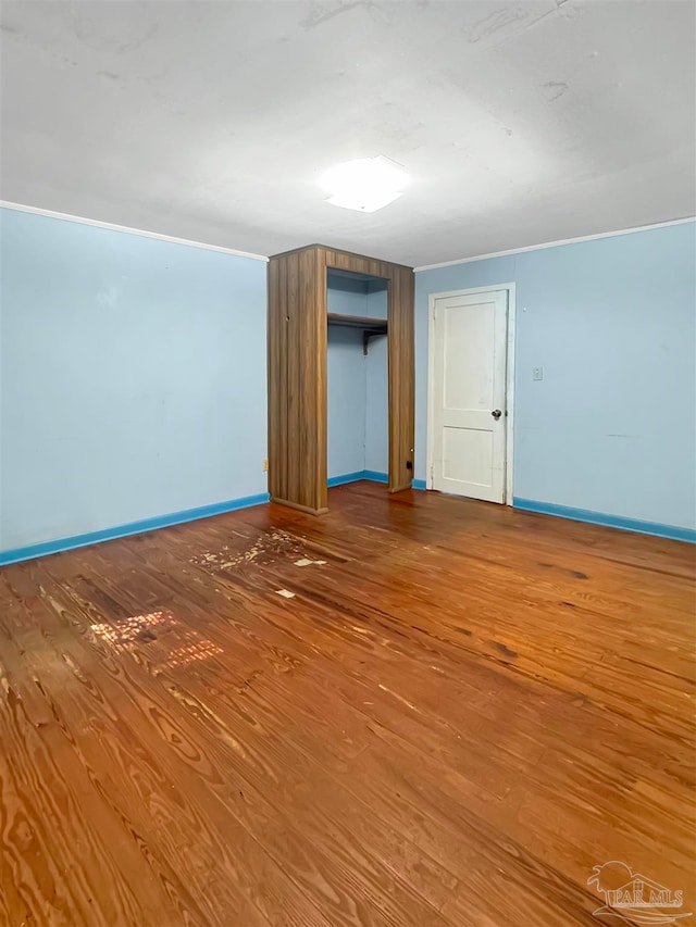 empty room with wood-type flooring