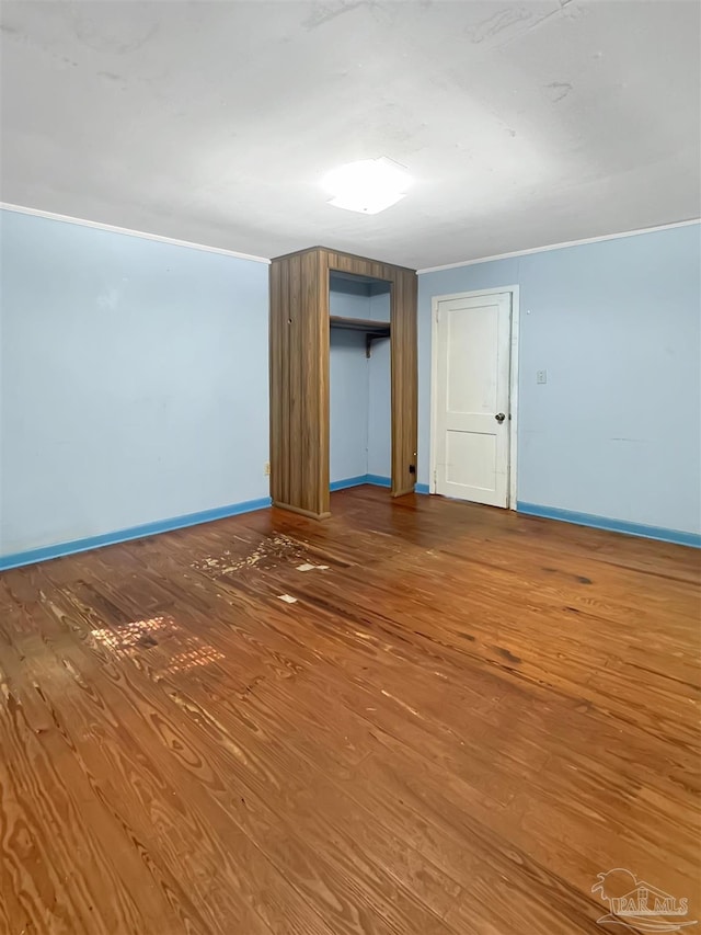 3020 Woodbury Cir, Cantonment, FL 32533 - unfurnished bedroom featuring wood finished floors and a closet