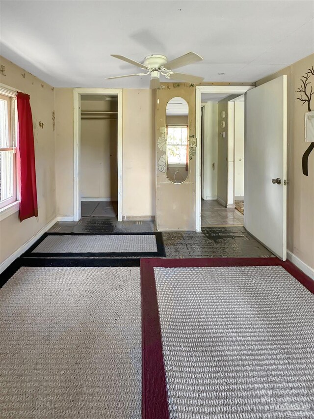 3020 Woodbury Cir, Cantonment, FL 32533 - unfurnished bedroom with a closet and a ceiling fan