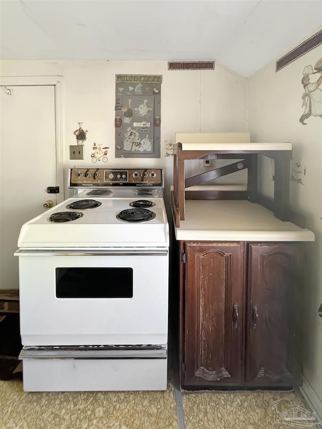3020 Woodbury Cir, Cantonment, FL 32533 - kitchen featuring white electric range oven, lofted ceiling, and light countertops