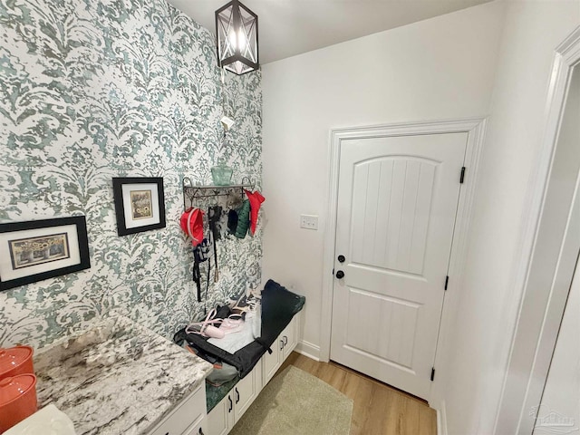 405 Waterbury Ct, Cantonment, FL 32533 - mudroom featuring wallpapered walls, light wood-style floors, and baseboards