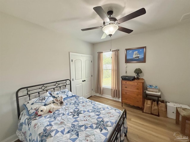405 Waterbury Ct, Cantonment, FL 32533 - bedroom with light wood finished floors, baseboards, and ceiling fan