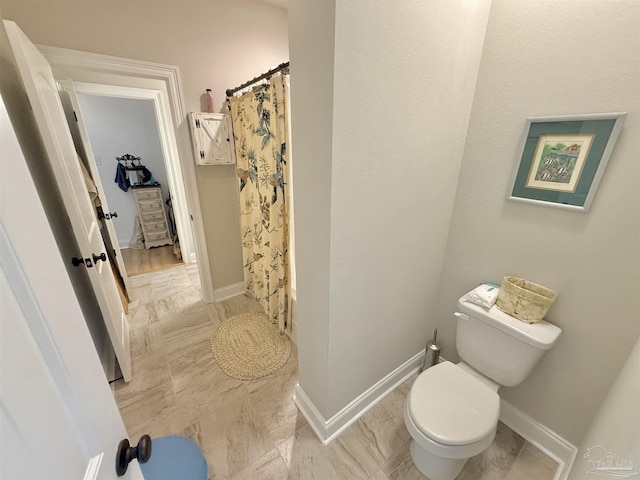 405 Waterbury Ct, Cantonment, FL 32533 - bathroom with toilet, curtained shower, and baseboards