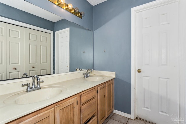 bathroom featuring double vanity and tile patterned floors