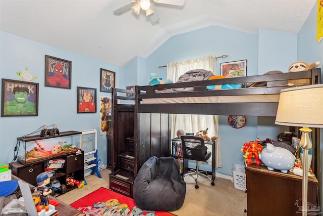 carpeted bedroom with ceiling fan and vaulted ceiling