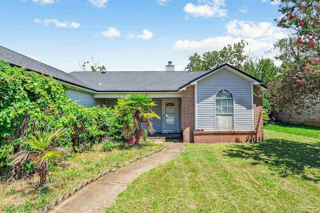 ranch-style home featuring a front yard