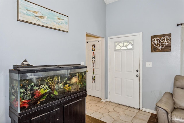 foyer entrance featuring light tile patterned flooring