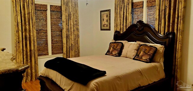 bedroom featuring wood-type flooring