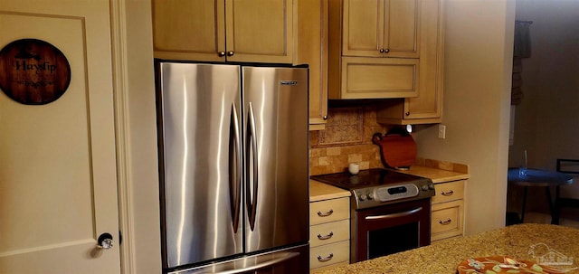 kitchen with stainless steel appliances and tasteful backsplash