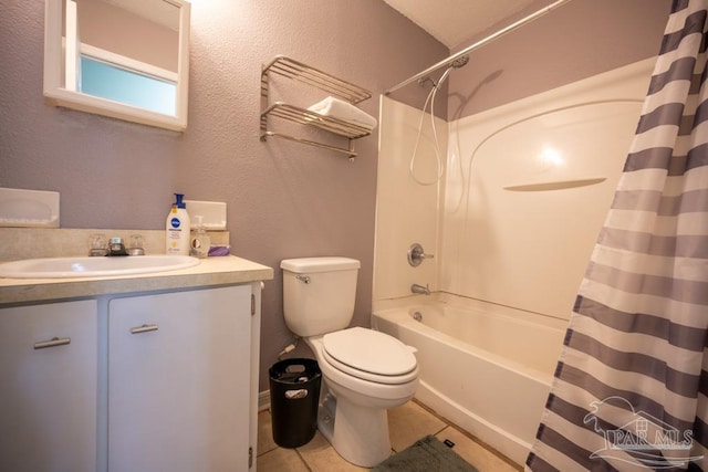 8687 John Hamm Rd, Milton, FL 32583 - bathroom featuring shower / tub combo, toilet, vanity, tile patterned flooring, and a textured wall