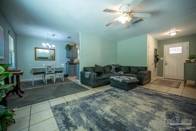 8687 John Hamm Rd, Milton, FL 32583 - tiled living area with ceiling fan, a chandelier, and baseboards