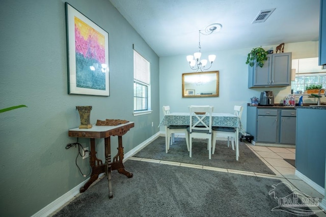 8687 John Hamm Rd, Milton, FL 32583 - dining room featuring a chandelier, healthy amount of natural light, and light carpet