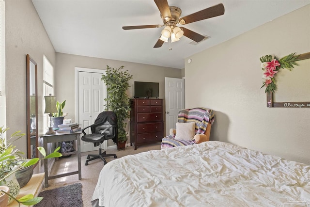 bedroom featuring visible vents, carpet floors, a closet, and ceiling fan