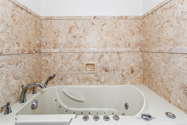 bathroom featuring a tub to relax in