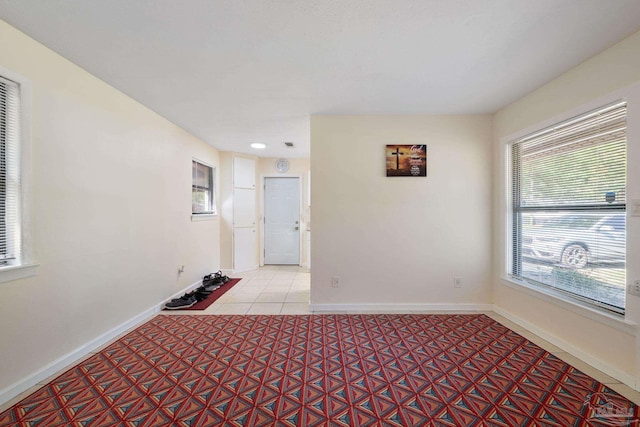 702 Beauvais Rd, Pensacola, FL 32505 - tiled spare room featuring baseboards
