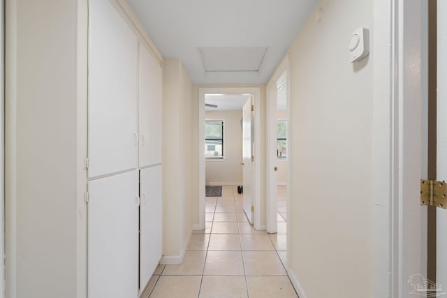 702 Beauvais Rd, Pensacola, FL 32505 - hallway with light tile patterned floors and baseboards