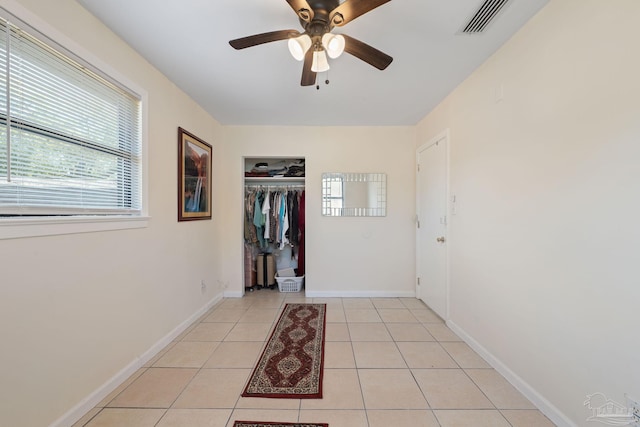 702 Beauvais Rd, Pensacola, FL 32505 - interior space with light tile patterned floors, visible vents, baseboards, and a ceiling fan