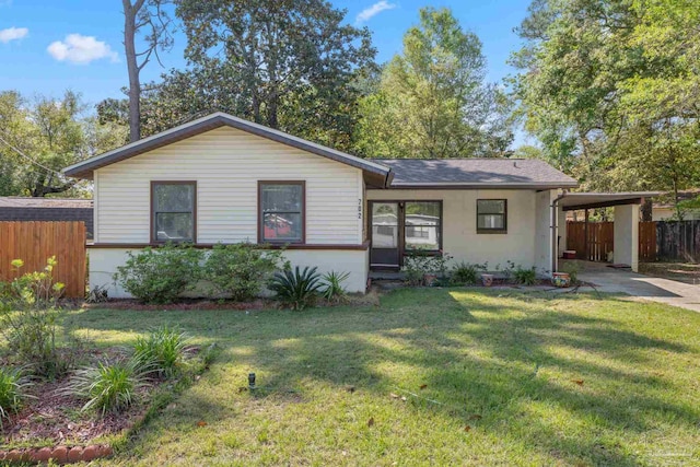 702 Beauvais Rd, Pensacola, FL 32505 - ranch-style home with a front yard, a shingled roof, a carport, fence, and concrete driveway