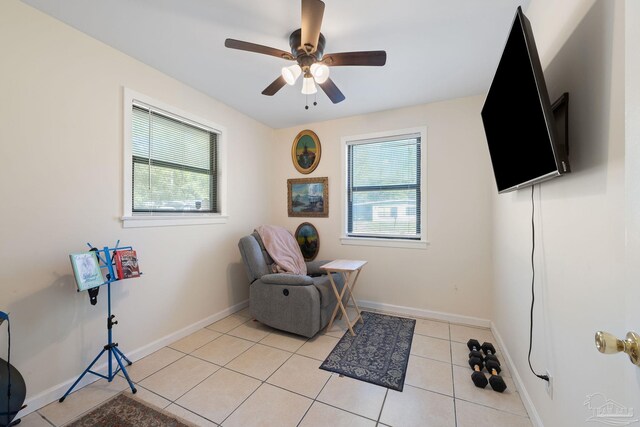 702 Beauvais Rd, Pensacola, FL 32505 - sitting room with baseboards, a ceiling fan, and light tile patterned flooring