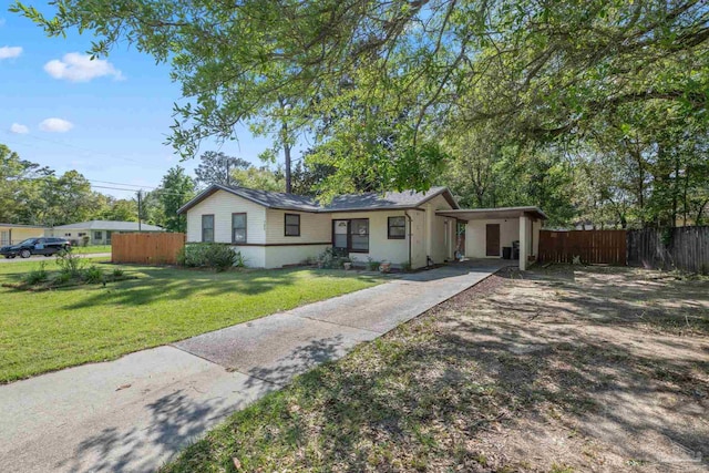 702 Beauvais Rd, Pensacola, FL 32505 - ranch-style home featuring driveway, a front yard, fence, and an attached carport