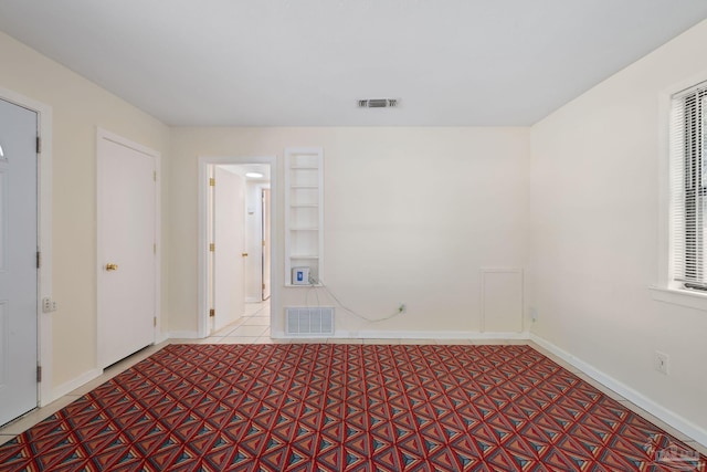 702 Beauvais Rd, Pensacola, FL 32505 - empty room featuring baseboards, visible vents, and a wealth of natural light