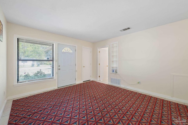 702 Beauvais Rd, Pensacola, FL 32505 - foyer entrance featuring baseboards and visible vents