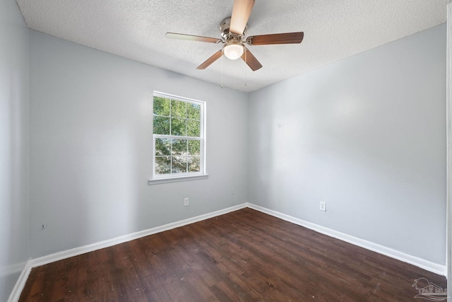 unfurnished room with ceiling fan, dark wood-type flooring, and a textured ceiling