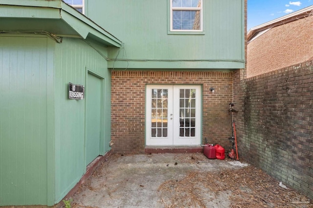 view of exterior entry featuring french doors